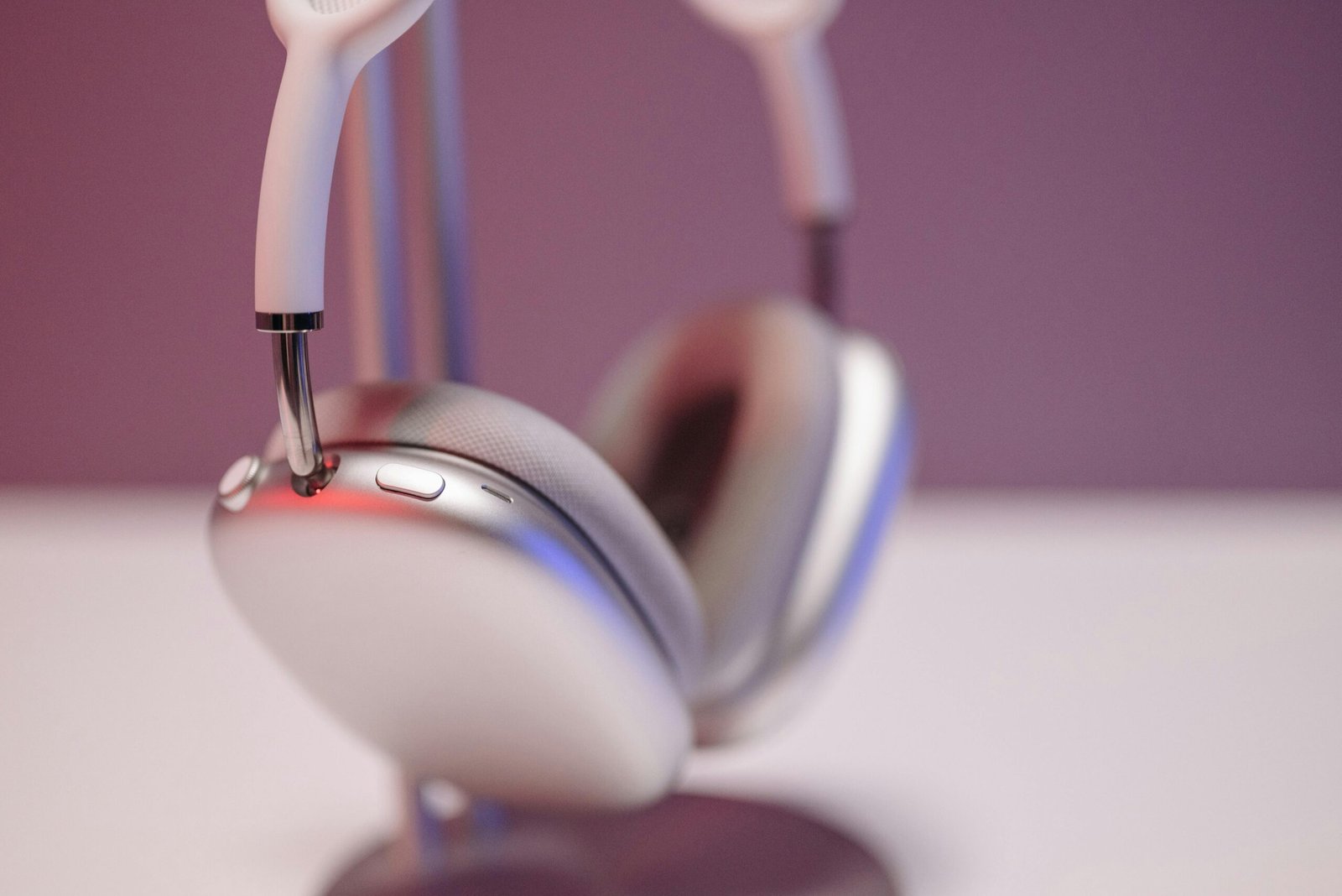 Sleek and stylish wireless headphones on a stand, perfect for music lovers and tech enthusiasts.